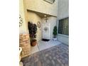 Elegant entryway with decorative door and landscaping at 6329 Kitamaya St, North Las Vegas, NV 89031
