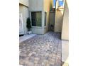 Brick paved walkway leading to side entrance of home at 6329 Kitamaya St, North Las Vegas, NV 89031