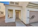 Front entrance with a taupe door and sidelights, leading into the home at 7808 License St, Las Vegas, NV 89131