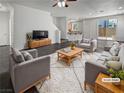 Virtually staged living room with modern furniture and fireplace at 10375 Beallsville St, Las Vegas, NV 89141