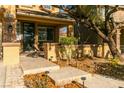 Front porch with stone walkway, landscaping, and a charming entrance at 10744 Balsam Creek Ave, Las Vegas, NV 89144