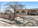 House exterior showcasing a front yard and driveway at 1215 Ferguson Ave, North Las Vegas, NV 89030