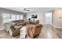 Relaxing living room with comfortable seating and large windows at 1664 Hartley Ave, Henderson, NV 89052