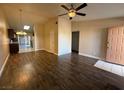 Open living area with wood-look floors and view to kitchen at 1804 Discus Dr, Las Vegas, NV 89108