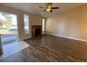 Bright living room with fireplace and wood-look floors at 1804 Discus Dr, Las Vegas, NV 89108