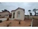 One-story house with brown garage door and desert landscaping at 2104 Fountain View Dr, Las Vegas, NV 89134