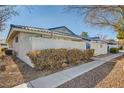 Side view of a house with blue gate and landscaping at 2137 Willowbury Dr # B, Las Vegas, NV 89108