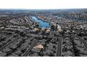 Aerial view of house and surrounding neighborhood near lake at 3109 Siena Cir, Las Vegas, NV 89128