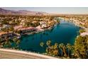 Community overview featuring a lake and numerous homes at 3109 Siena Cir, Las Vegas, NV 89128