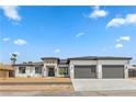 Contemporary home with three-car garage and clean lines at 311 Belfast St, Henderson, NV 89015