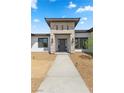 Inviting entryway with stone accents and modern lighting at 311 Belfast St, Henderson, NV 89015