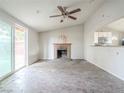 Living room with a fireplace and sliding glass door at 3644 San Pascual Ave, Las Vegas, NV 89115