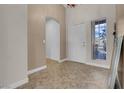 Bright entryway with tile flooring and a view to the hallway at 4613 Golden Palomino Ln, North Las Vegas, NV 89032