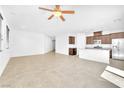Open-concept living room with tile flooring and abundant natural light at 5640 Akula Bay St, North Las Vegas, NV 89081