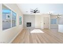 Living room with fireplace and sliding glass door at 6529 Za Zu Pitts Ave # 102, Las Vegas, NV 89122