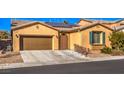 Tan house with brown garage door, teal shutters, and a landscaped yard at 6733 Violet Bluff Ct, North Las Vegas, NV 89084