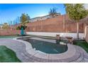 Inviting kidney-shaped pool with brick coping at 7131 Rosecrans St, Las Vegas, NV 89166