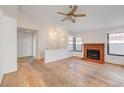 Bright living room with hardwood floors and fireplace at 759 Whispering Palms Dr, Las Vegas, NV 89123