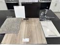 Kitchen design options with dark cabinets, quartz countertops, and vinyl plank flooring at 9189 Oakdale Ranch Ct, Las Vegas, NV 89139