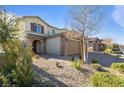 Two-story house with stone accents and a two-car garage at 3957 Little Creek Ave, Las Vegas, NV 89141