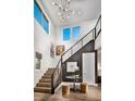 Modern staircase with metal railing and wood steps at 10130 Sequoia Glen Ave, Las Vegas, NV 89166