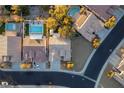 An aerial view showcasing a house and neighborhood with pool at 1057 Daylight Blaze Way, Henderson, NV 89052