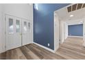 Bright entryway with double doors and blue accent wall at 1513 Irene Dr, Boulder City, NV 89005