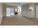 Living room with fireplace and view into kitchen area at 2975 Bluegrass Ln # 422, Henderson, NV 89074