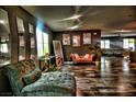 Elegant living room featuring hardwood floors and stylish furniture at 3439 Midnight Shadows Way, North Las Vegas, NV 89032