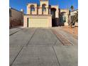 Inviting two-story home with a spacious driveway and attached two-car garage at 4466 Palm Grove Dr, Las Vegas, NV 89120