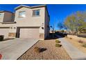 Two-car garage and side yard of a townhome at 846 Star Estates Ave, North Las Vegas, NV 89086