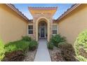 Inviting front entry with stone accents and landscaping at 10372 Hawks Wing St, Las Vegas, NV 89178