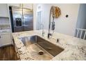 Modern kitchen sink and granite countertop at 161 Petaluma Valley Dr, Las Vegas, NV 89138