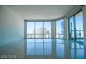 Spacious living area featuring large windows with city views at 222 Karen Ave # 2601, Las Vegas, NV 89109