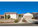 Single-story house with a two-car garage and desert landscaping at 2356 Weaverville Dr, Henderson, NV 89044