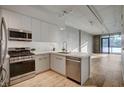 Modern kitchen with island, stainless steel appliances, and open floor plan at 353 E Bonneville Ave # 457, Las Vegas, NV 89101