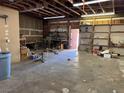 Spacious garage with workshop and ample storage shelving at 4980 W Weddle Way, Moapa, NV 89025