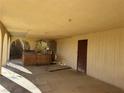 Covered patio with hot tub and access to the home at 4980 W Weddle Way, Moapa, NV 89025