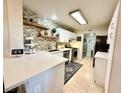 Modern kitchen with white cabinets and quartz countertops at 7733 Allerton Ave, Las Vegas, NV 89128