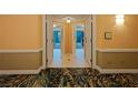 Elegant hallway with tile floors and carpet leading to rooms at 145 E Harmon Ave # 2215, Las Vegas, NV 89109