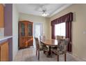 Dining area with a table and chairs near a china cabinet at 1518 Jenny Linn Dr # 105, Henderson, NV 89014