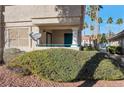 Private patio with satellite dish and view of landscaping at 1518 Jenny Linn Dr # 105, Henderson, NV 89014