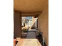 Covered walkway leading to front door with potted plants at 1762 Sunflower Ct, Henderson, NV 89074