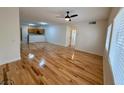 Bright living room featuring hardwood floors and abundant sunlight from windows at 2001 Jasper Bluff St # 102, Las Vegas, NV 89117