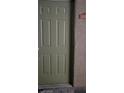 Green front door with a simple design at 2101 Blue Breeze Dr # 104, Las Vegas, NV 89128