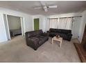 Living room with couches, coffee table and view into bedroom at 2102 E Russell Rd, Las Vegas, NV 89119