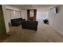 Living room with fireplace and two brown sofas at 2102 E Russell Rd, Las Vegas, NV 89119