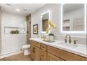 Spa-like bathroom with double vanity, large mirrors, and a walk-in shower at 2500 W Oakey Blvd, Las Vegas, NV 89102