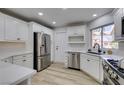 Modern kitchen with stainless steel appliances and white cabinets at 2856 Billy Casper Dr, Las Vegas, NV 89134