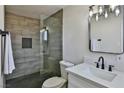 Bathroom with a walk-in shower, modern vanity, and updated fixtures at 3225 Crawford St, North Las Vegas, NV 89030